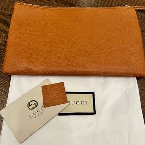 Authentic Gucci Clutch with tassel.  beautiful bag!!! Brand new condition.